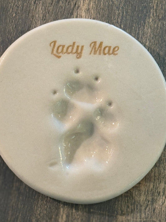 Ceramic paw print keepsake personalized with the name Lady Mae